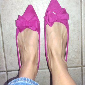 Adorable pink shoes with a bow